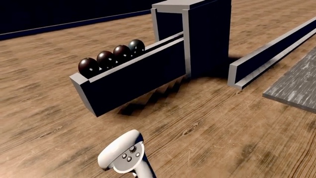 VR Bowling oyununda bowling topları, kulvar ve Meta Quest 2 kontrolcüsü